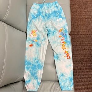 By Sam ii Ryan raining Care Bears sweatpants in blue tie dye size small